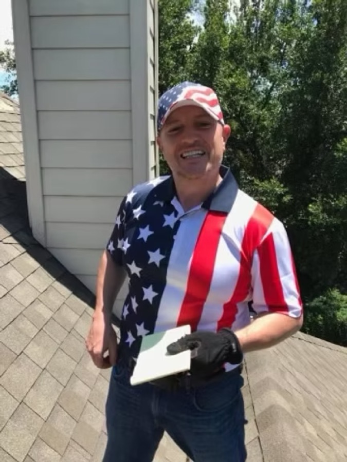 Eric Pieper, Owner of Patriot Construction DFW on a DFW rooftop